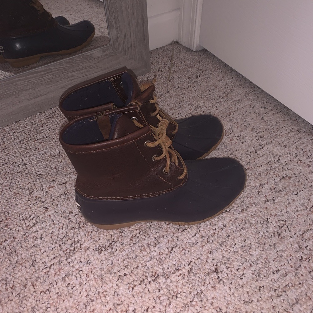 brown and blue sperry boots